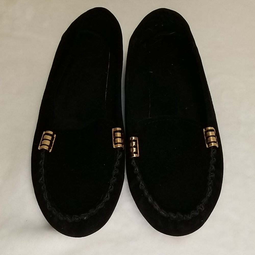 Black loafers with bronze detailing